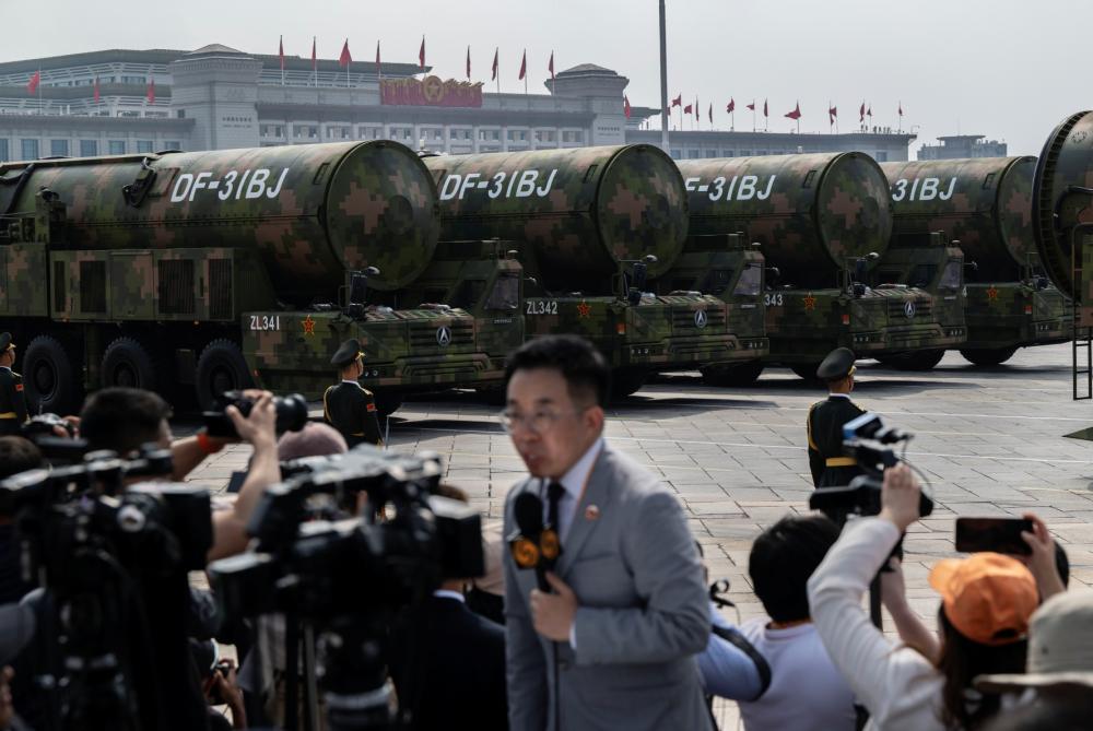 Nuclear capable DF-31BJ ballistic missiles are seen as they are unveiled on transporters during a military parade marking the 80th anniversary of victory over Japan and the end of World War II, in Tiananmen Square on September 3, 2025, in Beijing, China.