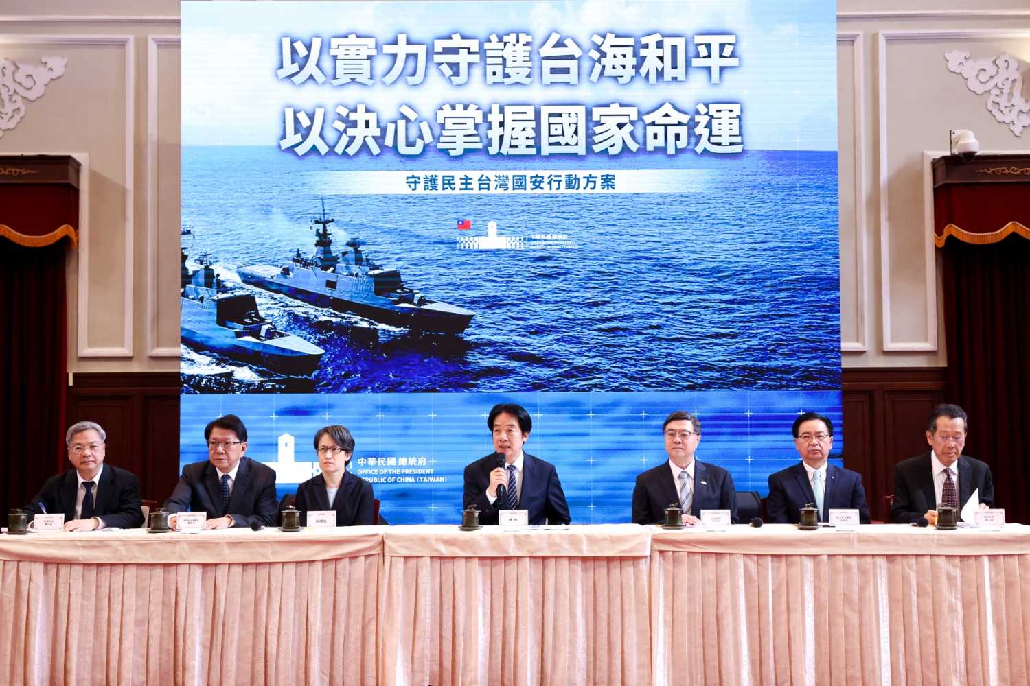 (L-R) Taiwan's Minister of Economic Affairs Kung Ming-hsin, Secretary-General to the President Pan Men-an, Vice President Hsiao Bi-khim, Taiwan's President Lai Ching-te, Taiwan's Premier Cho Jung-tai, Secretary-General of the National Security Council Joseph Wu, and Taiwan's Defence Minister Wellington Koo hold a news conference at the Presidential Office Building in Taipei on November 26, 2025.