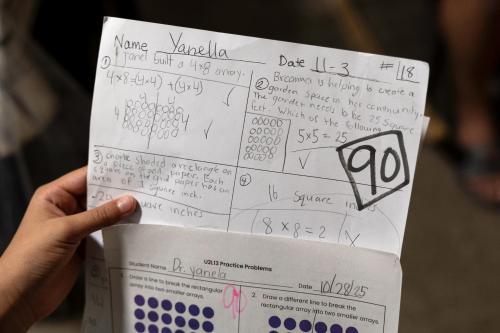UNSPECIFIED, UNITED STATES - NOVEMBER 19 — A 9-year-old girl shows off classwork at her family's apartment on November 19, 2025 at an unspecified location in the United States. Like many of her fellow immigrant students, she stayed home from school earlier in the week due to a Border Patrol operation in the area. Her mother brought her to the U.S. from Honduras in 2018, crossing the Rio Grande from Mexico to McAllen, Texas. They were later released to pursue their asylum process in U.S. immigration court.