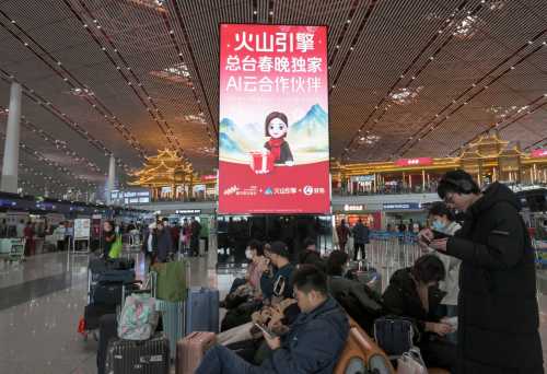 This picture taken on February 5, 2026 shows advertising promoting ByteDance's cloud and AI service platform 'Volcano Engine' and chatbot 'Doubao' at the Beijing Capital International airport in Beijing.