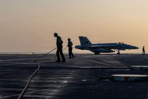 In this U.S. Navy released handout, an F/A-18E Super Hornet, attached to Strike Fighter Squadron (VFA) 14, taxis the flight deck after an arrested landing on Nimitz-class aircraft carrier USS Abraham Lincoln (CVN 72) in support of Operation Epic Fury on March 1, 2026 at sea.