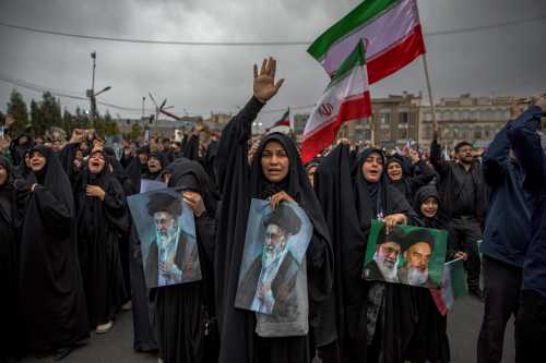 Women hold pictures of Ayatollah Ali Khamenei as they mourn in Kerman, Iran, on March 1, 2026, after Khamenei, Iran's supreme leader since 1989, was killed in the opening salvo of joint U.S. and Israeli strikes on February 28.