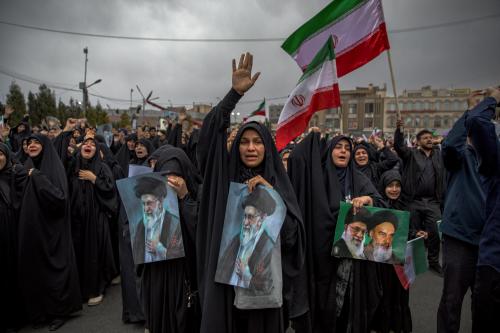 Women hold pictures of Ayatollah Ali Khamenei as they mourn in Kerman, Iran, on March 1, 2026, after Khamenei, Iran's supreme leader since 1989, was killed in the opening salvo of joint U.S. and Israeli strikes on February 28.
