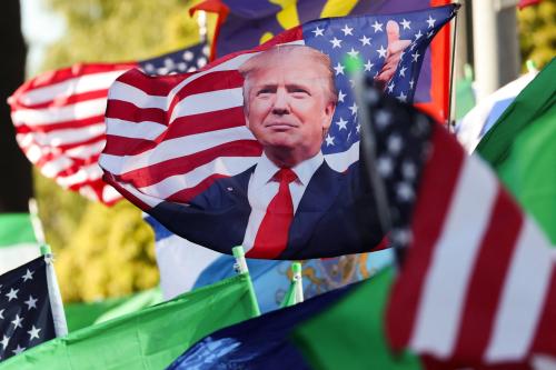 A flag featuring US President Donald Trump blows in the wind as Iranian community members gather in support of regime change in Iran outside of the Westwood Federal Building in Los Angeles, California on March 7, 2026.