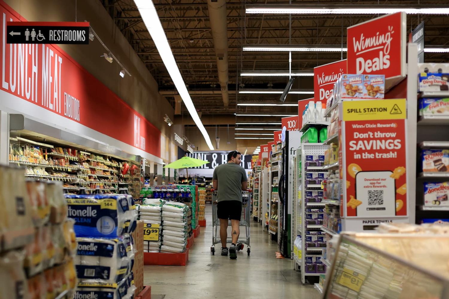MIAMI, FLORIDA - MARCH 11: A customer shops in a grocery store on March 11, 2026 in Miami, Florida. According to the Bureau of Labor Statistics data that was released the consumer price index increased seasonally adjusted 0.3% for the month, putting the 12-month inflation rate at 2.4%.