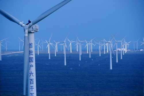 At the Dabancheng wind farm, wind energy contributes a bit to China's energy needs, but burning fossil fuels is still China's largest energy source.