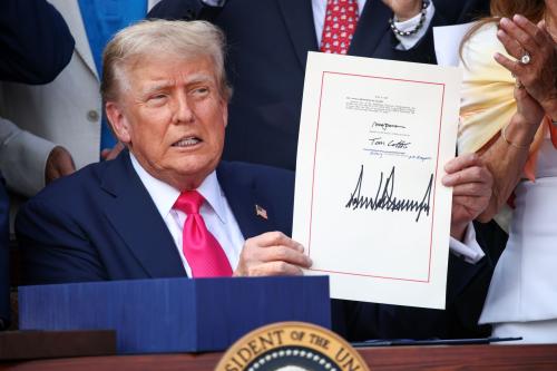 WASHINGTON, DC - JULY 04: U.S. President Donald Trump, joined by Republican lawmakers, signs the One, Big Beautiful Bill Act into law during an Independence Day military family picnic on the South Lawn of the White House on July 04, 2025 in Washington, DC.