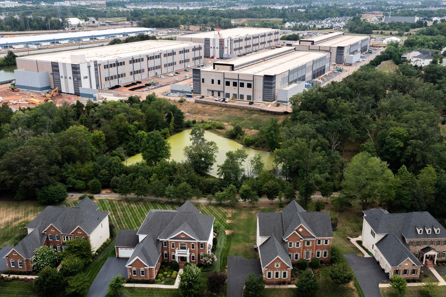 STONE RIDGE, VIRGINIA - JULY 17: In an aerial view, an Amazon Web Services data center is shown situated near single-family homes on July 17, 2024 in Stone Ridge, Virginia. (Photo by Nathan Howard/Getty Images)