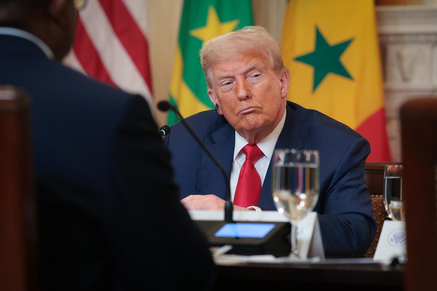 President Trump listens to speakers at a luncheon at the White House