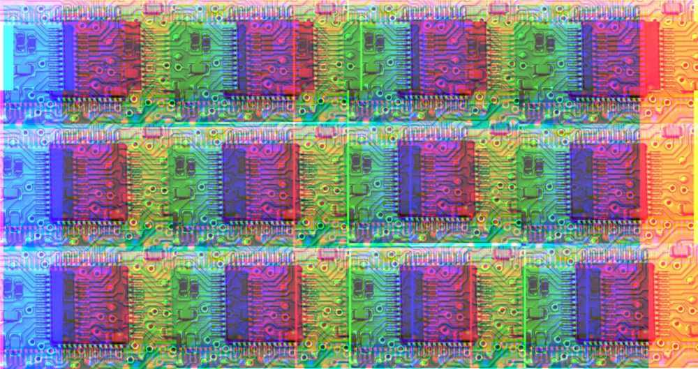 A repeating pattern of a photograph of a silicon chip, recoloured so that it is multi-coloured, in the style of pop art.