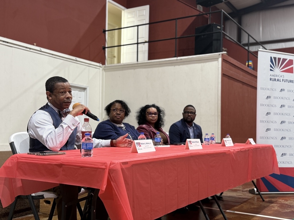 Panelists Walter Atkins, Sandra Wilborn, Chaquina Taylor, and Mario Robinson seated left to right discussing early childhood education at Y.O.U. Early Learning Academy near Quitman County Elementary School.
