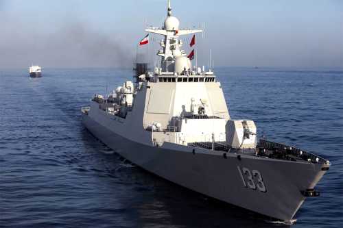 This handout photo made available by the Iranian Army Office on March 11, 2025 shows the Chinese People's Liberation Army Navy guided-missile destroyer Baotou (133) during joint military drills between Iran, Russia, and China in the Gulf of Oman.
