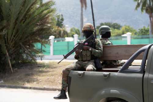 Members of the Haitian armed forces (FADH) patrol the city center near the National Palace in Port-au-Prince on October 1, 2025.