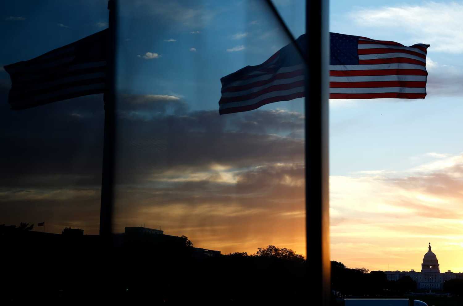 WASHINGTON, DC - OCTOBER 01: The U.S. Capitol is seen reflected in a window at the Washington Monument on October 01, 2025 in Washington, DC.