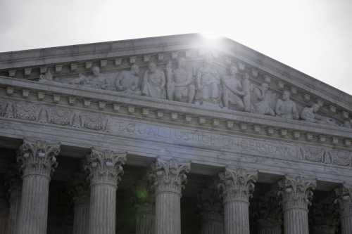 WASHINGTON, DC - MARCH 31: The sun rises above a facade of the U.S. Supreme Court building on March 31, 2026 in Washington, D.C.