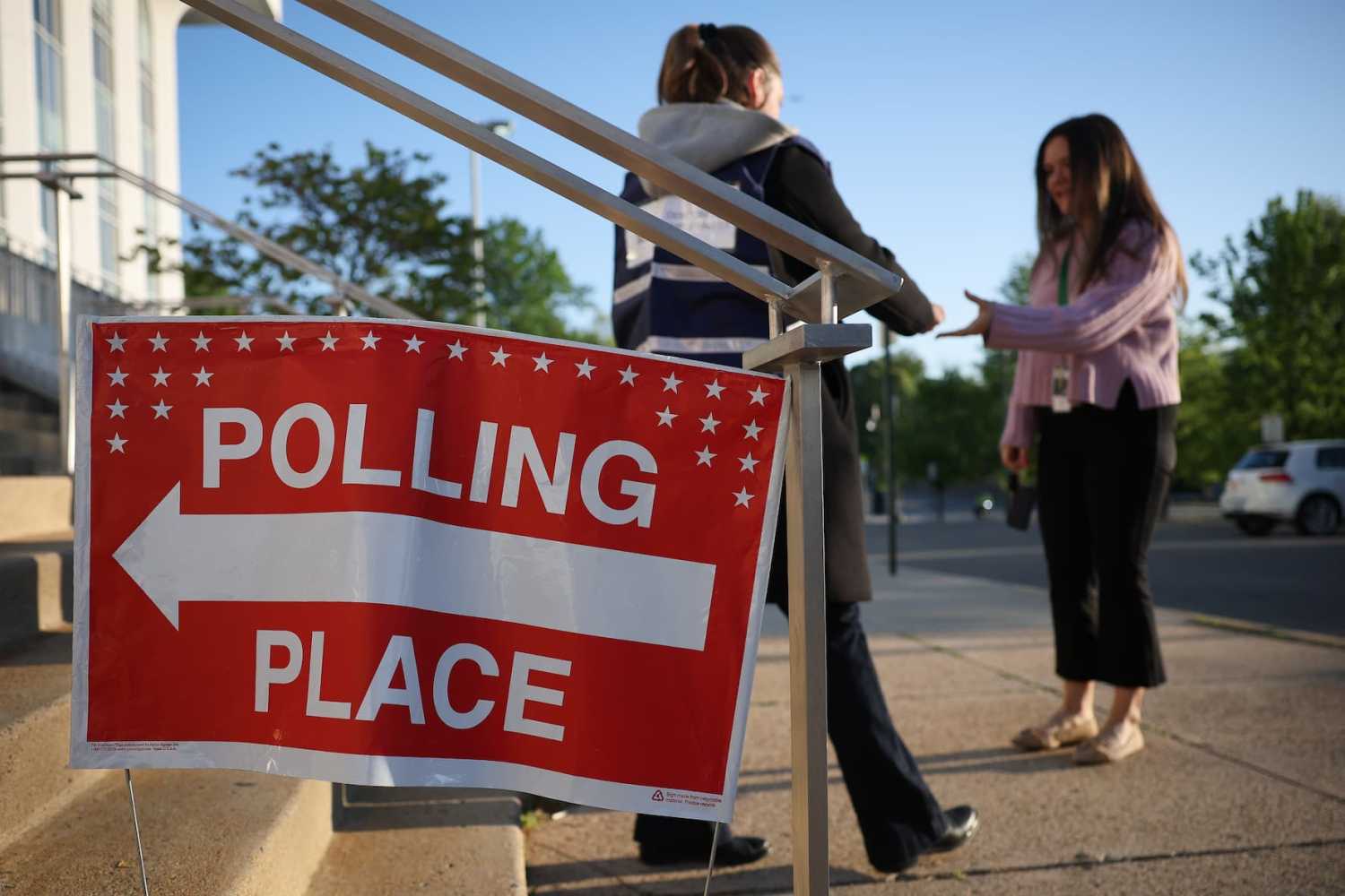 Voters arrive before casting their ballots at a polling location at Washington-Liberty High School on April 21, 2026 in Arlington, Virginia. Virginia voters will decide today on a statewide ballot question on whether to allow the Virginia General Assembly to redraw congressional districts which could affect how the state’s U.S. House districts are mapped in upcoming elections and shift political balance.