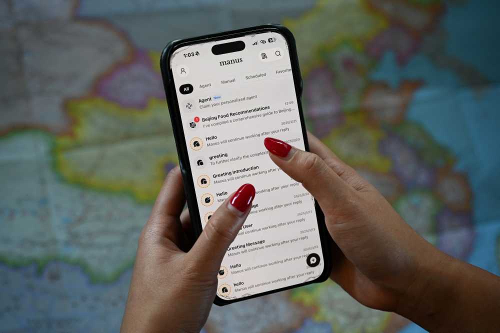 This photo illustration shows the Manus app on a mobile phone in Beijing on April 28, 2026.