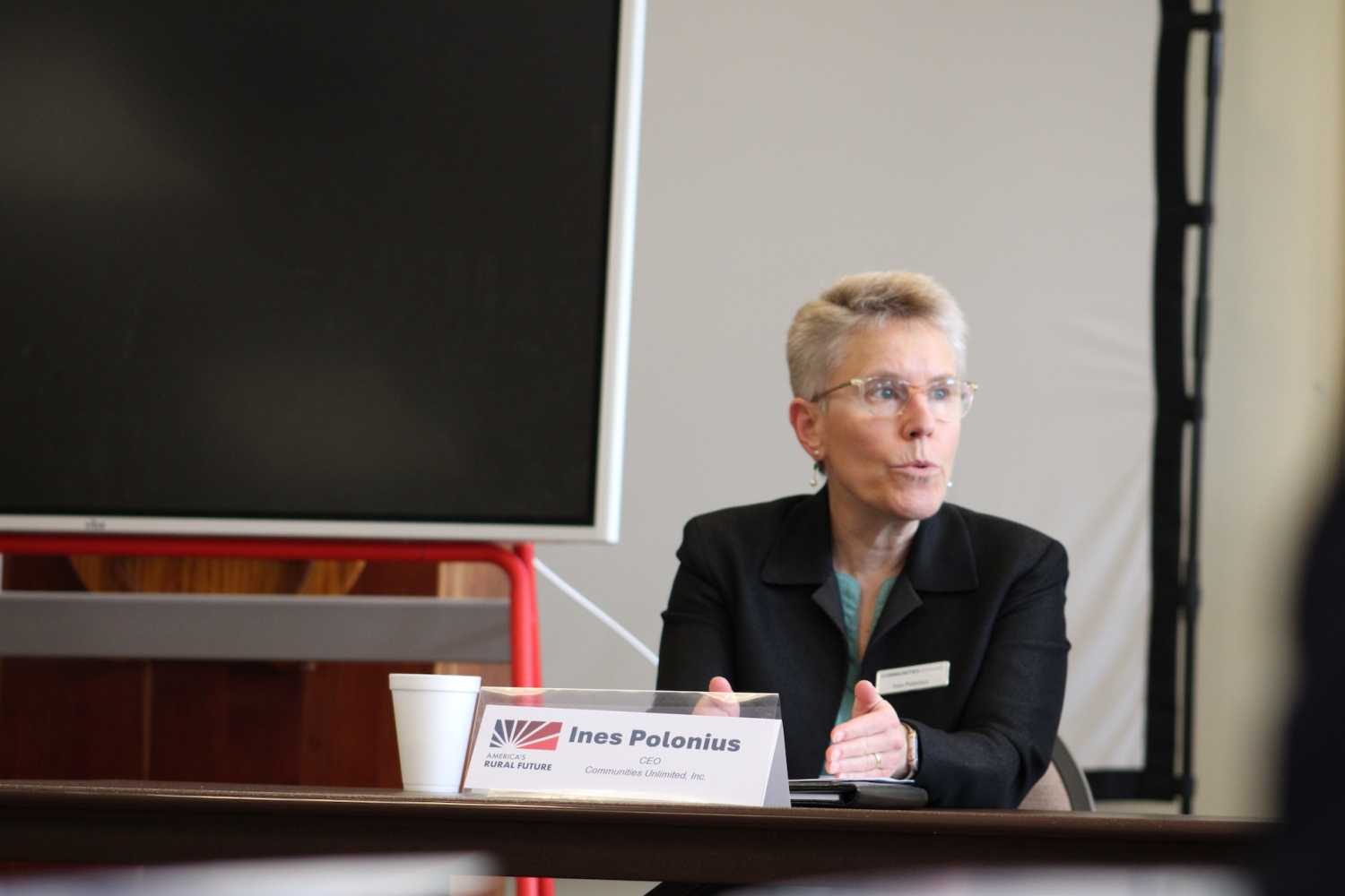 Ines Polonius, CEO of Communities Unlimited, addressing the Yazoo City panel on structural barriers limiting rural communities' access to federal resources.