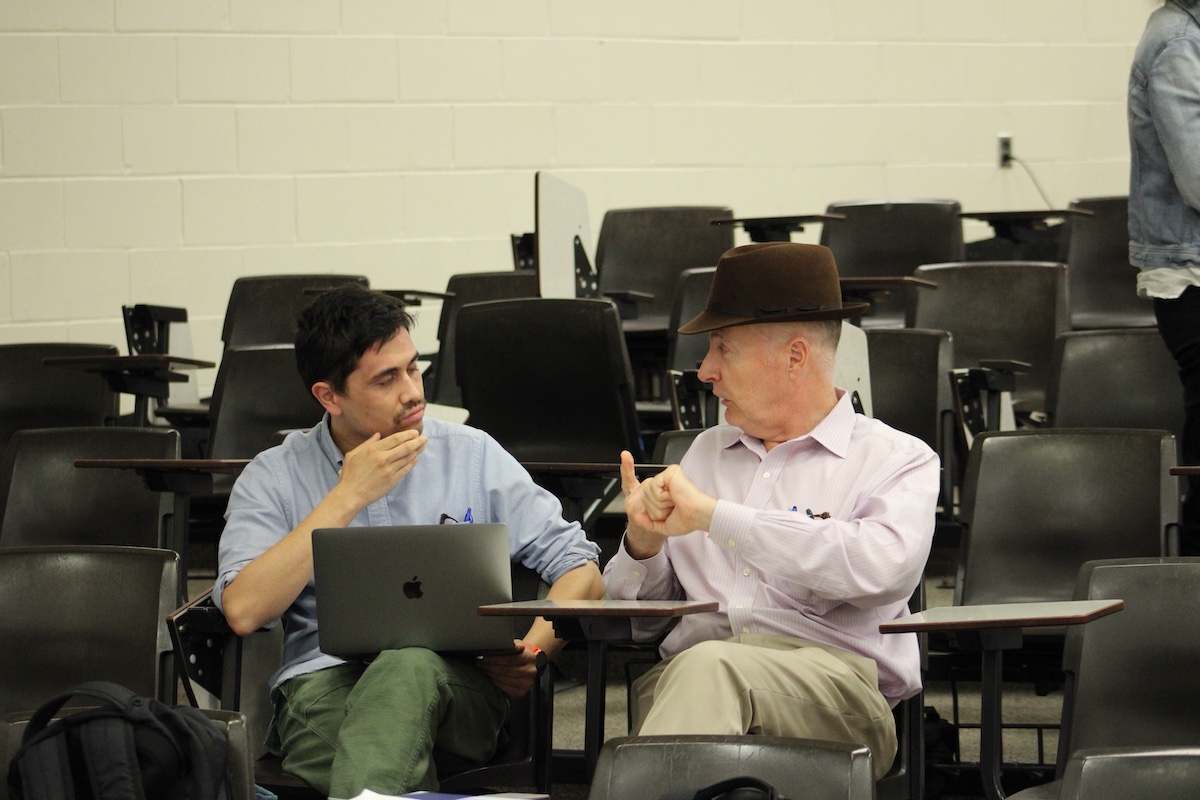 Commission Member Keith Humphreys speaking with a reporter after the public forum at Mississippi Valley State University.