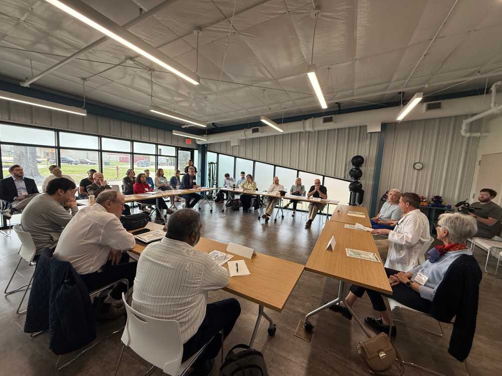 America's Rural Future Commission participants seated in a large square of tables