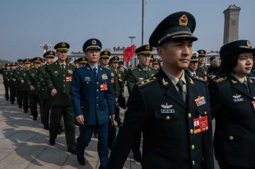 Members of the Chinese Military delegation march into the closing session of the National People's Congress at the Great Hall of the People on March 12, 2026 in Beijing, China
