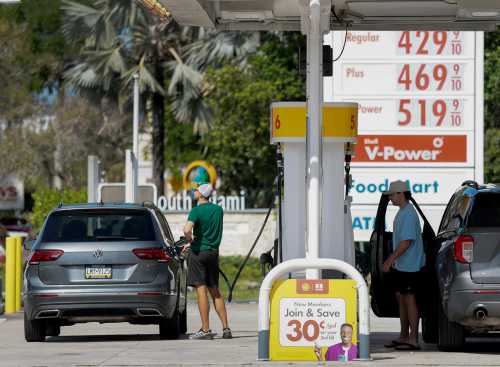 MIAMI, FLORIDA - APRIL 13: Fuel prices are displayed on a sign as customers fill their vehicles at a gas station on April 13, 2026 in Miami, Florida. As the United States military blockades the Strait of Hormuz fuel prices rose above $100 dollars a barrel. (Photo by Joe Raedle/Getty Images)