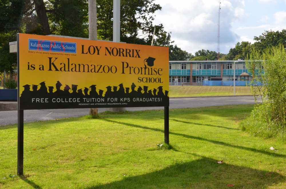 A sign at Loy Norrix High School in Kalamazoo, Michigan, promotes the Kalamazoo Promise on Aug. 12, 2017. The program provides free college tuition to eligible graduates of the district.