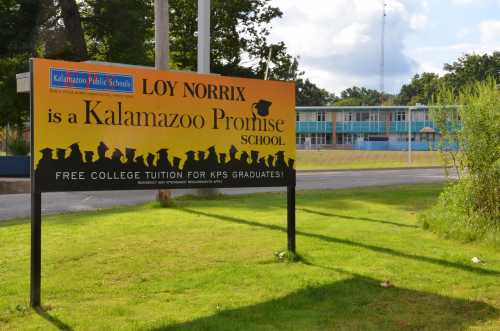 A sign at Loy Norrix High School in Kalamazoo, Michigan, promotes the Kalamazoo Promise on Aug. 12, 2017. The program provides free college tuition to eligible graduates of the district.