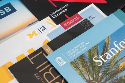 college pamphlets stacked on top of each other