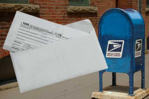 illustration of a tax document and US mail box