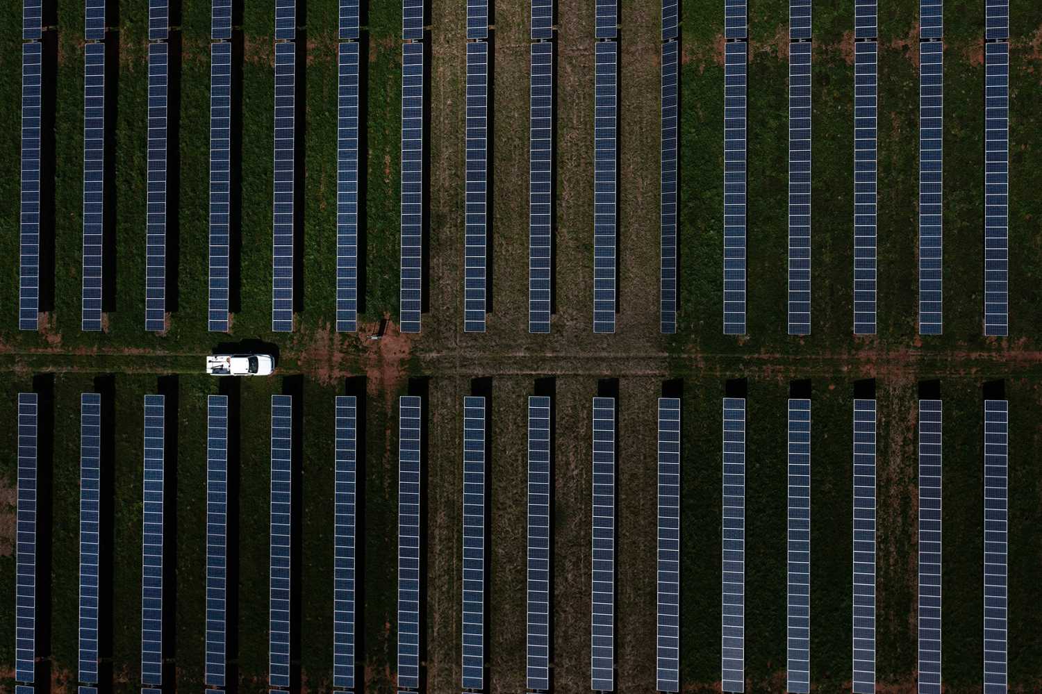 This aerial image shows a vehicle driving through a solar farm, which produces energy that could power nearly half the town, on former US President Jimmy Carter's land in Plains, Georgia, on February 22, 2023. - Jimmy Carter, the 98-year-old former US president who led the nation from 1977 to 1981, is receiving hospice care at home, where he will spend his "remaining time," his nonprofit foundation said on February 18, 2023. (Photo by Brendan Smialowski / AFP) (Photo by BRENDAN SMIALOWSKI/AFP via Getty Images)
