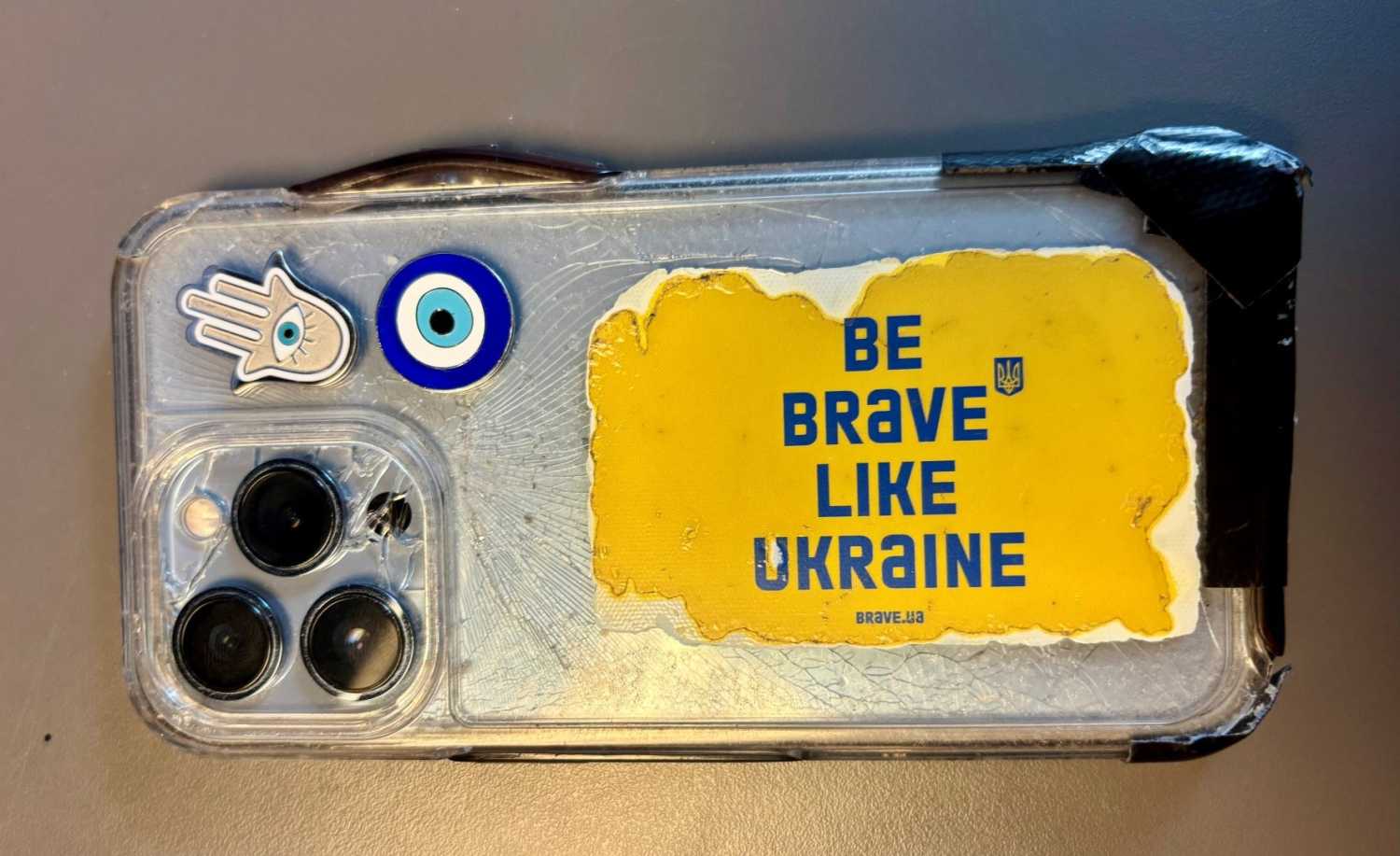 A sticker with the words "Be Brave Like Ukraine" is adhered to the back of author Fiona Hill's phone.