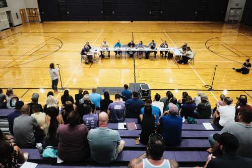 school board meeting in gym