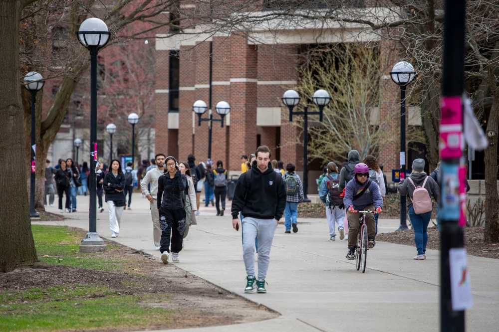 ANN ARBOR, MICHIGAN - APRIL 3: University of Michigan students walk on the UM campus on April 3, 2025 in Ann Arbor, Michigan.
