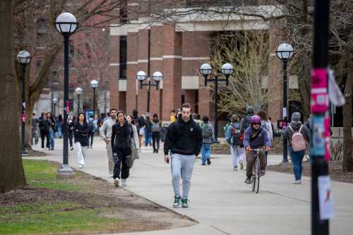 ANN ARBOR, MICHIGAN - APRIL 3: University of Michigan students walk on the UM campus on April 3, 2025 in Ann Arbor, Michigan.