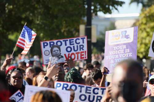 Activists and participants gather in front of the Supreme Court of the United States during Supreme Court re-argument of Louisiana v. Callais on October 15, 2025 in Washington, D.C.