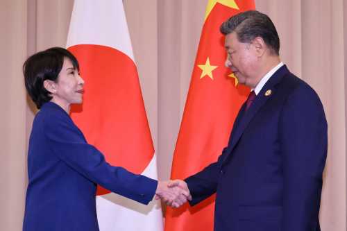 Japan's Prime Minister Sanae Takaichi (L) shakes hands with Chinese President Xi Jinping ahead of the Japan-China summit on the sidelines of the Asia-Pacific Economic Cooperation (APEC) Summit in Gyeongju on October 31, 2025.