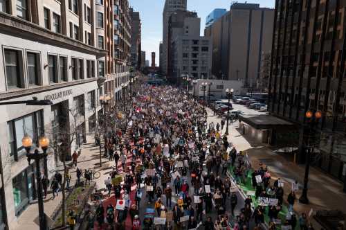 CHICAGO, ILLINOIS - MARCH 28: Thousands of demonstrators march through downtown to protest policies of the Trump administration, during a No Kings march on March 28, 2026 in Chicago, Illinois.