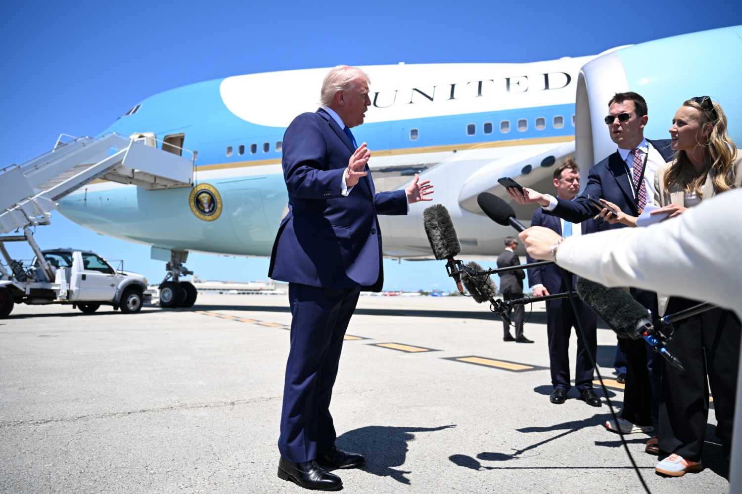U.S. President Donald Trump speaks to the traveling press before boarding Air Force One at the Palm Beach International Airport on April 25, 2026, in West Palm Beach, Florida.