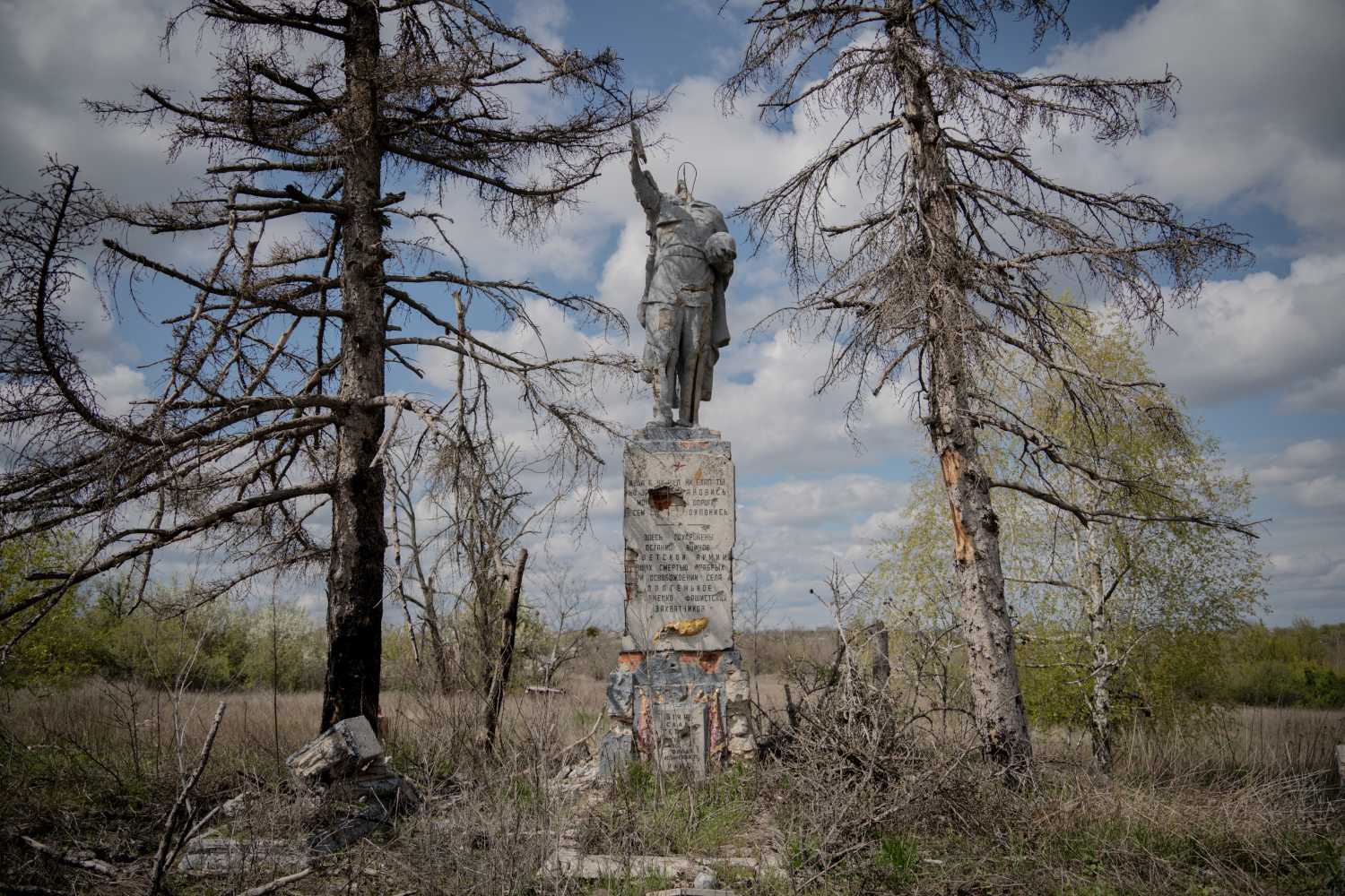 This photograph shows a monument to a Soviet soldier, damaged during battles for the village in 2022, in the village of Dovhenke, Kharkiv region, on May 1, 2026, amid the Russian invasion of Ukraine.