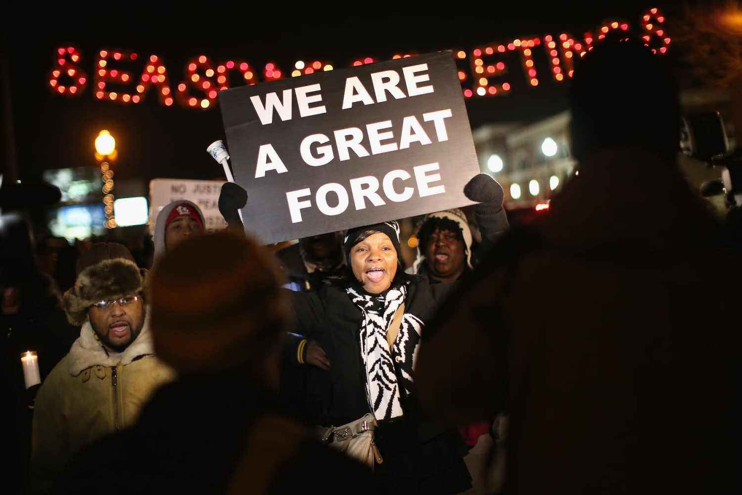 Demonstrators protest the shooting death of Michael Brown near the police station on Nov. 21, 2014 in Ferguson, Missouri. Brown, an 18-year-old black man, was killed by Darren Wilson, a white Ferguson police officer, on August 9.