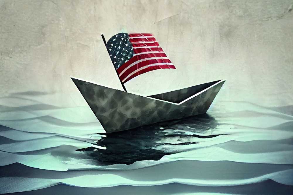 Paper boat with American flag in the sea