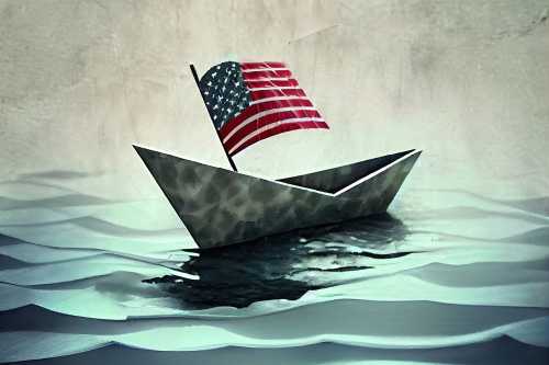 Paper boat with American flag in the sea