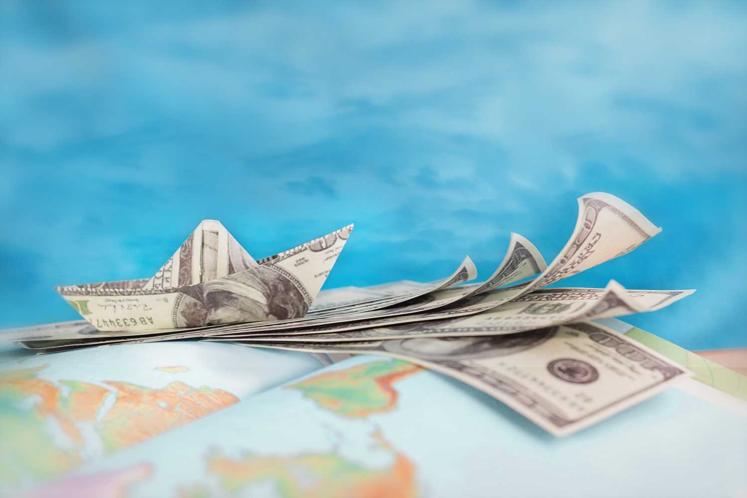 US dollar bills on rest on globe