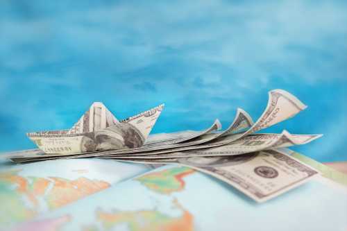 US dollar bills on rest on globe