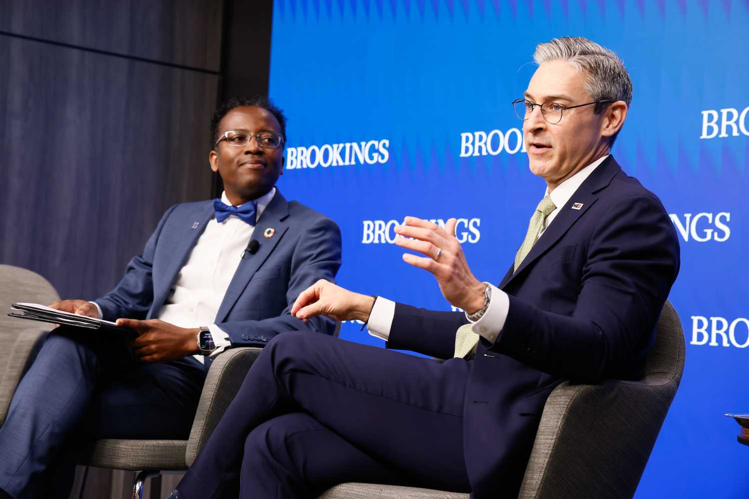Landry Signé and Damon Wilson speaking at a Brookings event.