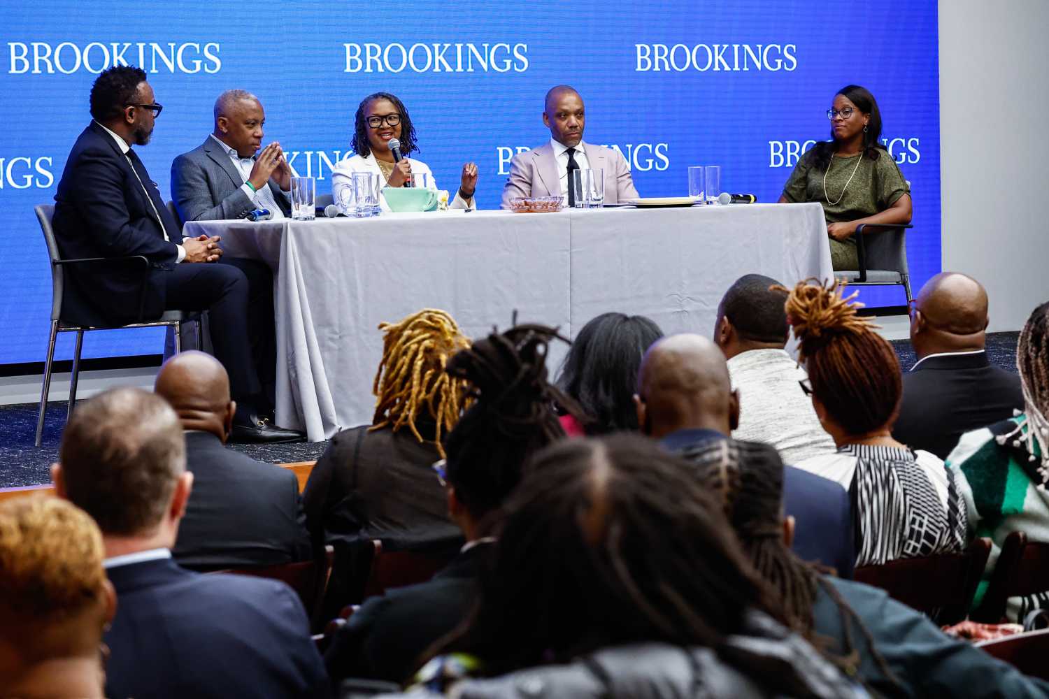Thomas Bowen, Calvin Mackie, Tonia Wellons, Andre Perry, and Fenaba Addo (L to R) speak on a panel at a Brookings event.