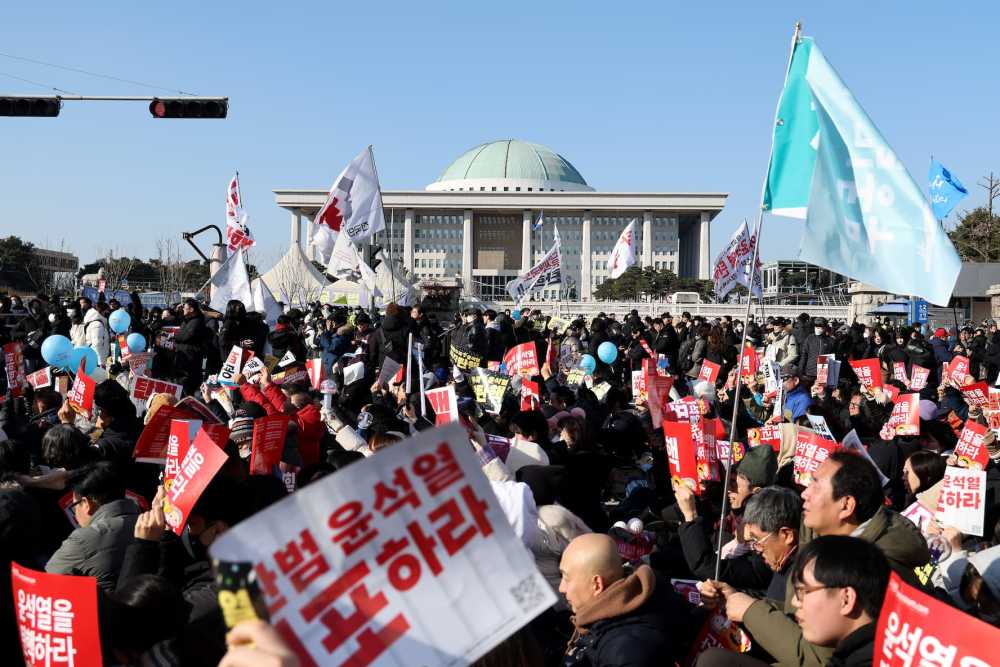 Protesters call for the impeachment of South Korean President Yoon Suk Yeol in front of National Assembly on Dec. 14, 2024 in Seoul, South Korea.