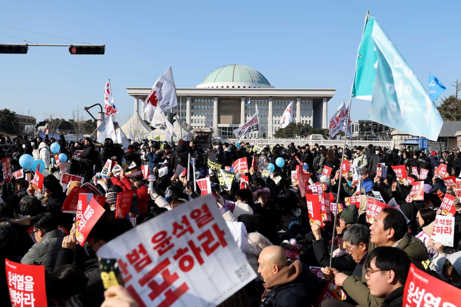 Protesters call for the impeachment of South Korean President Yoon Suk Yeol in front of National Assembly on Dec. 14, 2024 in Seoul, South Korea.