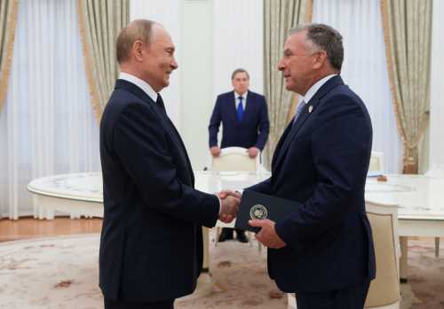 In this pool photograph distributed by the Russian state agency Sputnik, Russia's President Vladimir Putin greets US Special Envoy Steve Witkoff prior to their talks in Moscow on August 6, 2025.